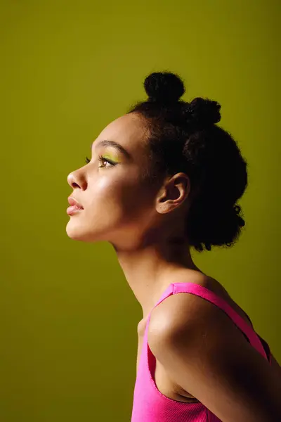 A young beautiful woman with unique hair stands elegantly showing off her fashion sense and style. — Stock Photo