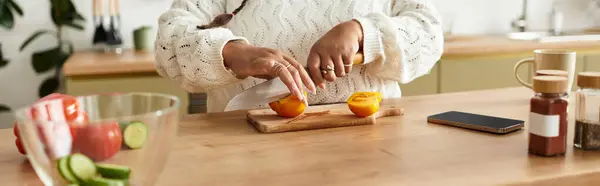 Young woman skillfully chops fresh tomato to create a vibrant salad in her cozy kitchen, banner — Stock Photo