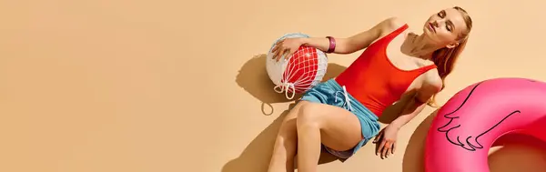 Young woman in summer attire relaxes with a beach ball, exuding joy in the sun. — Stock Photo