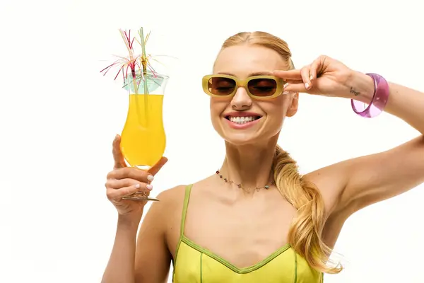 A bright summer day fills a young woman with joy as she sips a colorful drink in vibrant shades. — Stock Photo