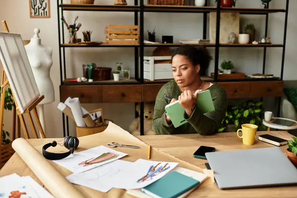 A woman in a craft workshop thinks about her next creative project, inspired by materials. — Stock Photo