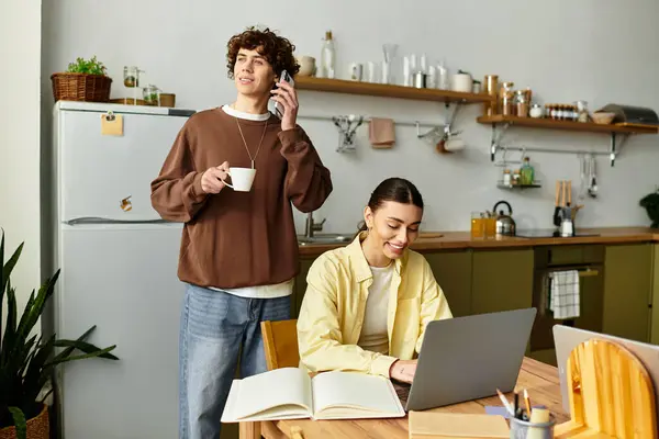 A couple shares a joyful moment at home, engaging in conversation and work together, radiating love. — Stock Photo