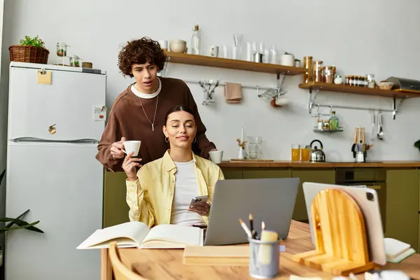 In a cozy kitchen, a man and woman share warmth over coffee as they enjoy each others company. — Stock Photo