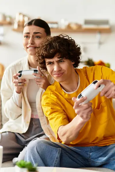 Loving couple engages in an exciting video game competition at home, sharing smiles and laughter. — Stock Photo
