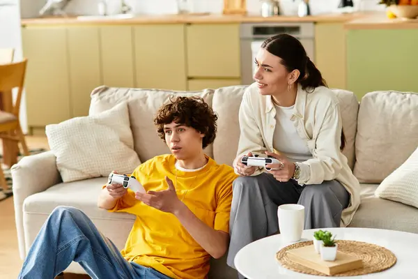 A couple shares laughter and connection while gaming in their comfortable home setting. — Stock Photo
