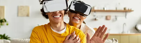 Loving couple enjoys an evening of laughter and connection while exploring virtual worlds together. — Stock Photo