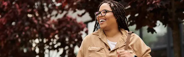 A university teacher enjoys a moment of connection with students amidst vibrant campus greenery. — Stock Photo