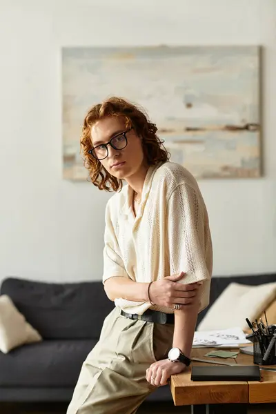 A young man relaxes at home, embodying comfort and style in a cozy environment. — Stock Photo