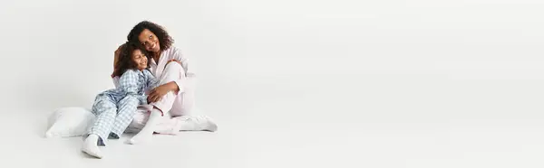 An African American Mother embraces her daughter, banner — Stock Photo