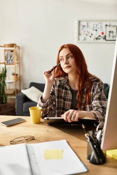 Woman deep in thought while working on a creative project at a cozy desk space. — Stock Photo