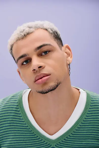 Stylish young African American man poses with confidence, highlighting his unique dyed hair. — Stock Photo