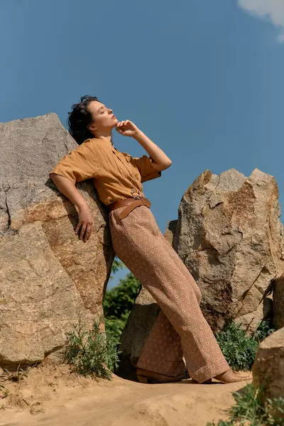A young woman with curly hair poses gracefully outdoors, embracing summer fashion. — Stock Photo