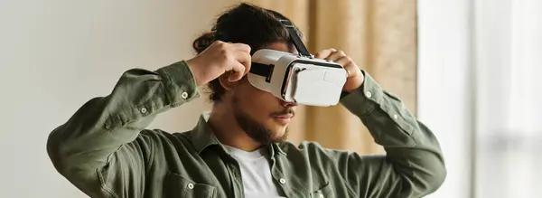A young man immerses himself in virtual reality for an exciting experience at home. — Stock Photo