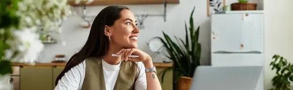 Young woman relaxes at home, smiling and embracing cozy vibes while daydreaming. — Stock Photo