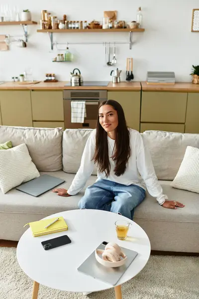 A young beautiful woman relaxes at home, engaged in a cozy and peaceful atmosphere. — Stock Photo