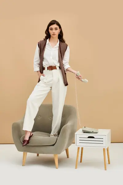 A young woman with long brown hair showcases modern fashion while posing gracefully. — Stock Photo