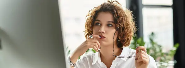 Curly-haired young businesswoman works diligently in her smart casual outfit, banner — Stock Photo