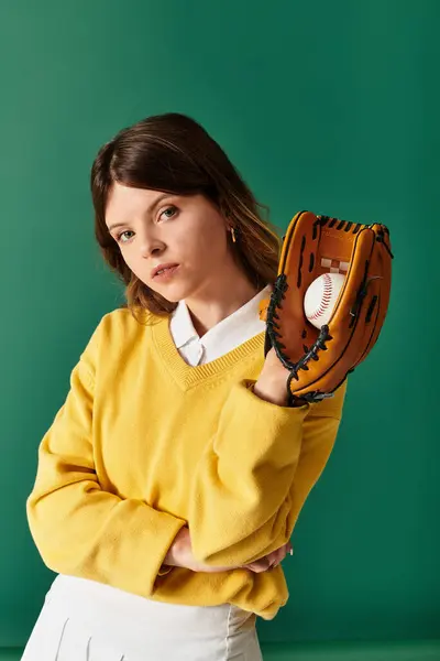 A woman, full of youthful energy, shows off her baseball glove in summer attire. — Stock Photo