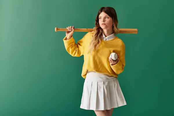 Bright summer day finds a young woman with a baseball bat and ball, exuding confidence and style. — Stock Photo