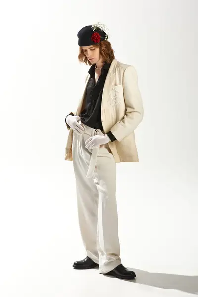 Young man showcases a unique blend of fashion and femininity with elegant clothing and accessories. — Stock Photo