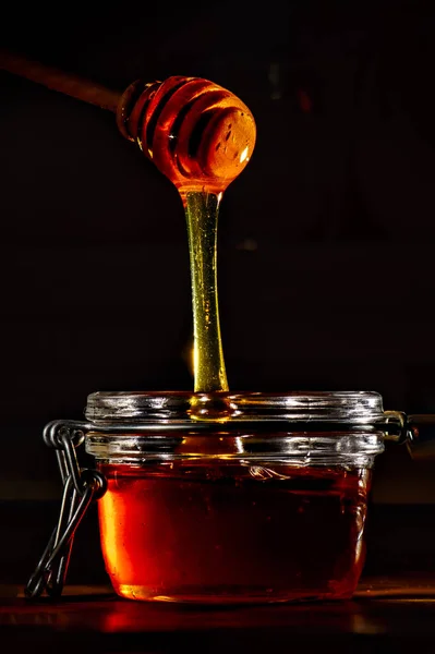 Honey Natural Wooden Stick Black Background — Stockfoto