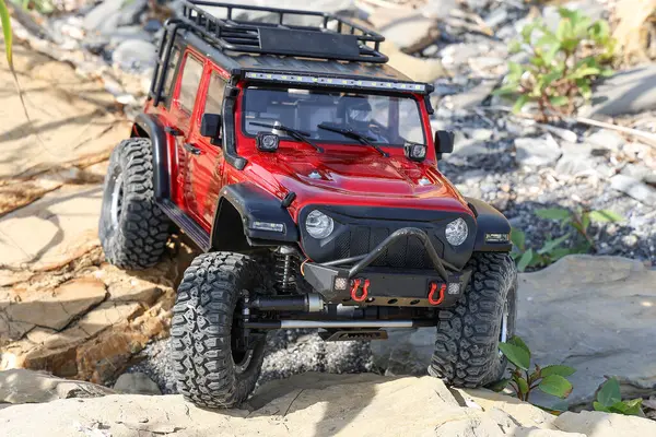 stock image Radio controlled model car climbing on a rock.