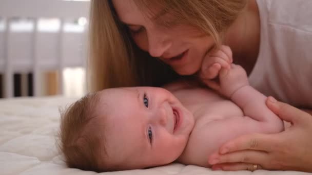 Close Mother Kissing Happy Baby Laughing Enjoying Loving Mom Nurturing — Stockvideo