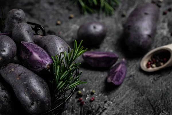 Japanese purple sweet potato. Raw sweet potatoes or batatas. pomoea batatas. Batata potato. vegan food ingredient. banner, menu, recipe place for text, top view.