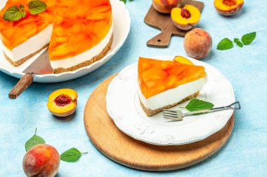 dessert peaches, cheesecake with peache jelly on white plate. Restaurant menu, dieting, cookbook recipe top view.