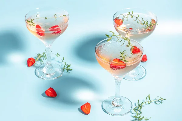 Glasses Cold Pink Champagne Punch Wine Strawberries Ice Rosemary Blue — Fotografia de Stock