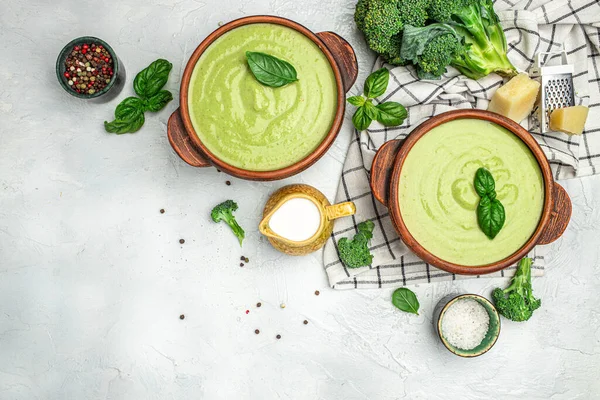 Traditional recipe of broccoli cheese soup with vegetables in a bowl, Restaurant menu, dieting, cookbook recipe top view,