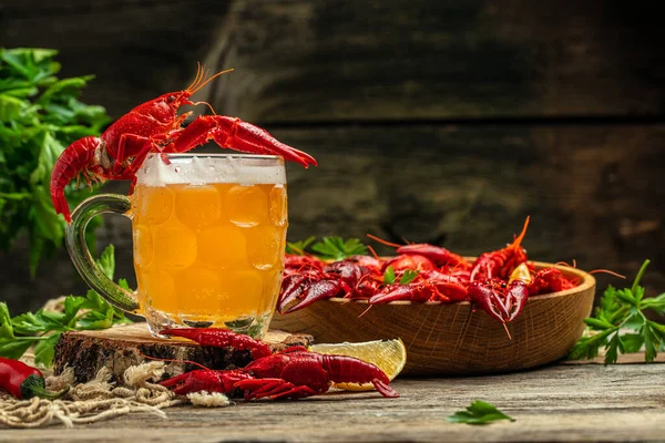 crayfish beer with lemon on a wooden background. Beer brewery concept. Snack for beer,
