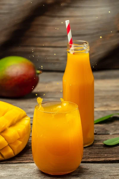 mango juice, Freeze motion splash drops of juice. vertical image. place for text,