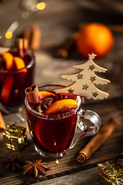 mulled wine, hot warming drink with spices and oranges, Traditional hot drink at Christmas.