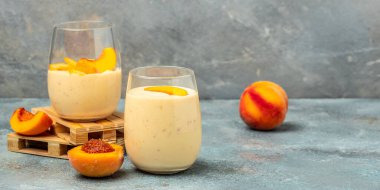 protein shake with peach milkshake, yogurt peaches breakfast drink, Long banner format,