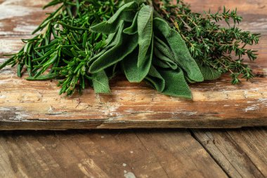rosemary, thyme and sage, Herbal Tea on a wooden background, banner, menu, recipe place for text, top view,