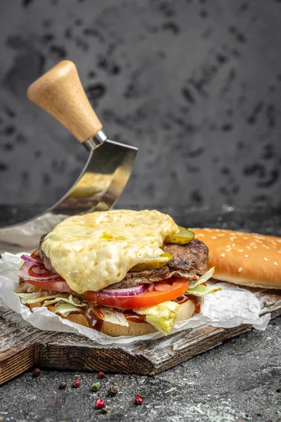 burger with melted cheese, Big cheeseburger with lots of cheese,