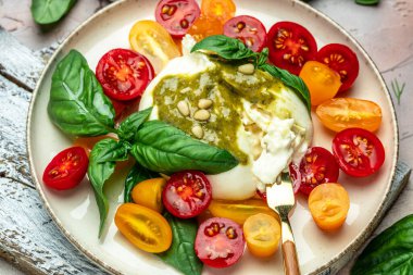 Salad with burrata cheese, cherry tomatoes