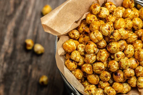 Spicy crispy roasted chickpeas. Traditional Indian cuisine. Tasty vegetarian and vegan chickpea snack. banner, menu, recipe place for text, top view.