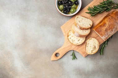 bread ciabatta and olives. banner, menu, recipe place for text, top view.