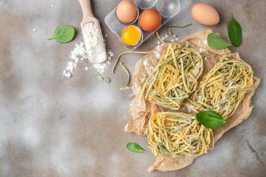 Fresh pasta being rolled and sliced. banner, menu, recipe place for text, top view.