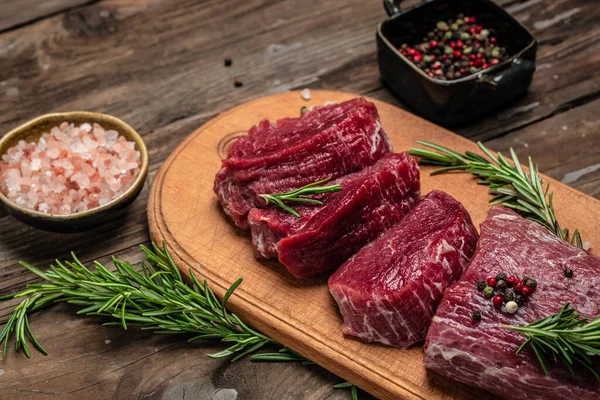 Beef Tenderloin fillet with rosemary and spices. Preparing fresh beef steak ready to cook, banner, menu, recipe place for text, top view,