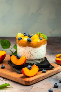 Peach smoothie dessert mousse yogurt with peaches blueberry chia. Eating healthy, vitamin rich Breakfast.