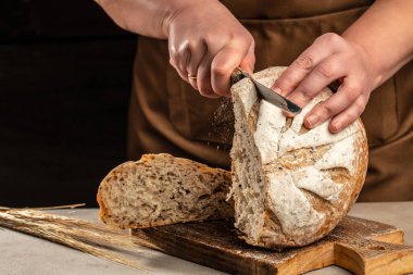 Whole grain bread put. Fresh bread slice. Bakery, food concept.