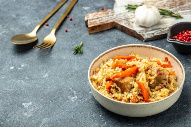 pilaf in a bowl, Uzbek dish. rice meat with vegetables. Restaurant menu, dieting, cookbook recipe top view.
