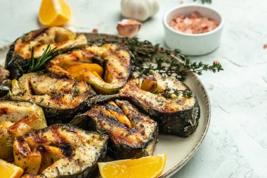 Delicious sturgeon steaks are grilled on a light background, Restaurant menu, dieting, cookbook recipe top view.