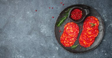 Spanish chorizo sausage with herbs and spices. Long banner format. top view.