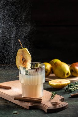 spicy cocktail with pears and thyme. Mulled wine. vertical image. top view. place for text