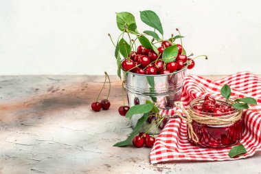 Berries cherry with syrup. Berries cherry with syrup. Canned fruit on a light background. Long banner format.