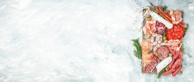 Italian meat platter prosciutto ham, salami. aperitivo party concept. Long banner format. top view,
